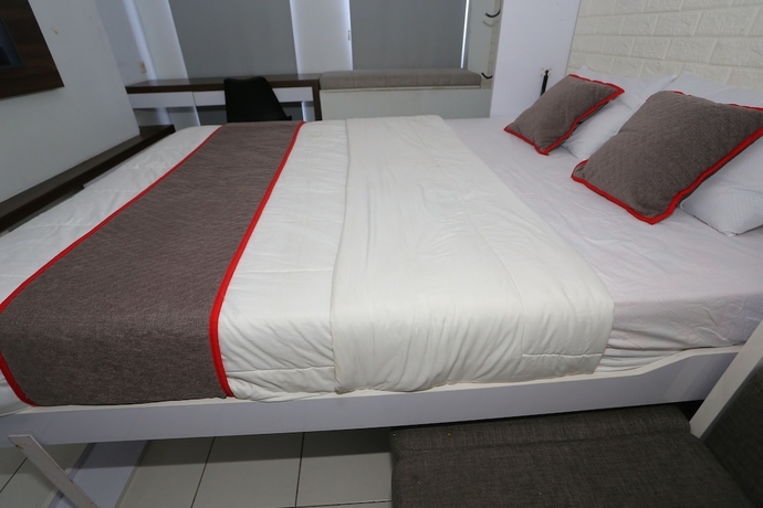 Imagen de la habitación del Hotel Capital O 93594 Pelangi Urbano. Foto 2