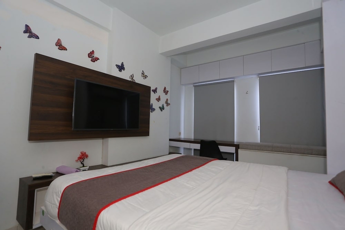 Imagen de la habitación del Hotel Capital O 93594 Pelangi Urbano. Foto 4