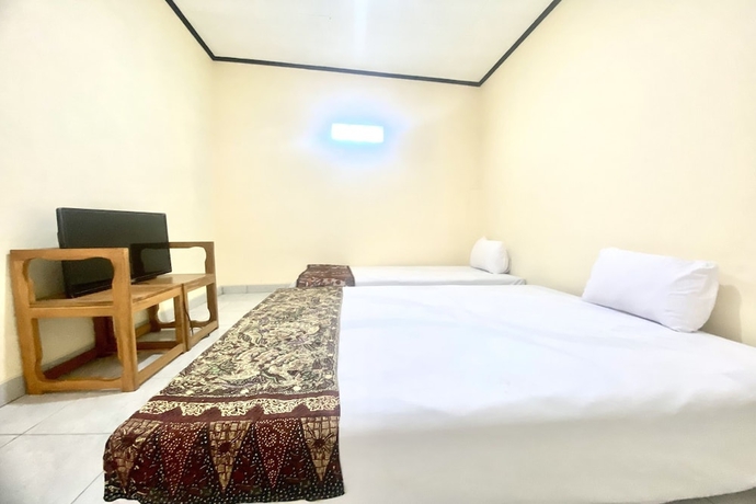 Imagen de la habitación del Hotel Capital O 93601 Manda Homestay. Foto 1