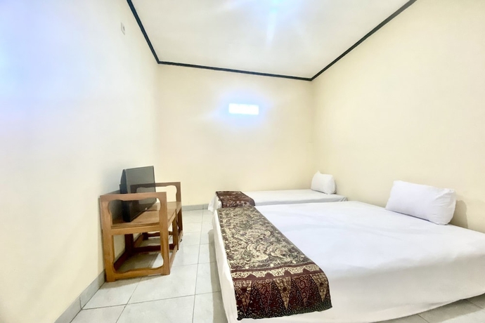 Imagen de la habitación del Hotel Capital O 93601 Manda Homestay. Foto 2