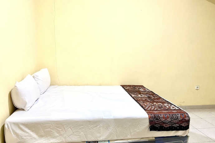 Imagen de la habitación del Hotel Capital O 93601 Manda Homestay. Foto 3