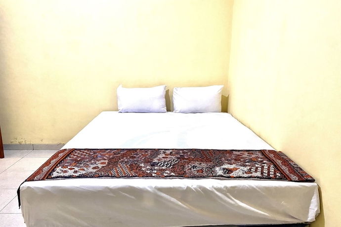 Imagen de la habitación del Hotel Capital O 93601 Manda Homestay. Foto 4