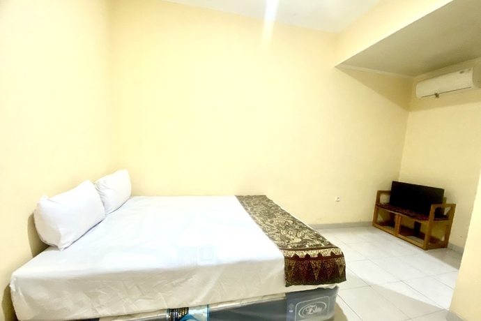 Imagen de la habitación del Hotel Capital O 93601 Manda Homestay. Foto 5