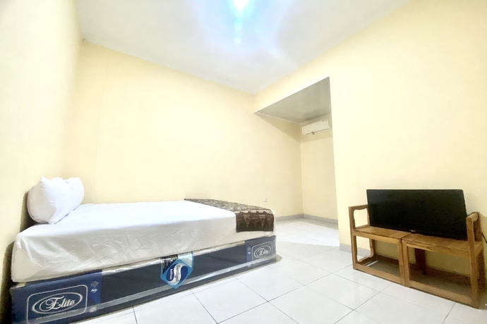 Imagen de la habitación del Hotel Capital O 93601 Manda Homestay. Foto 6