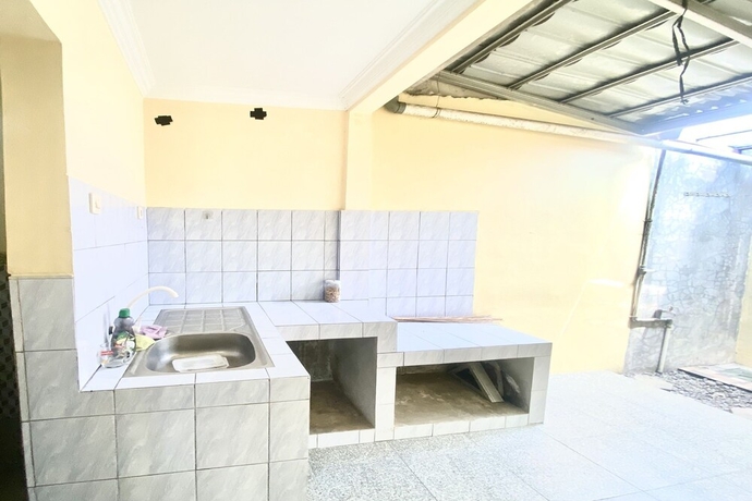 Imagen de los interiores del Hotel Capital O 93601 Manda Homestay. Foto 18