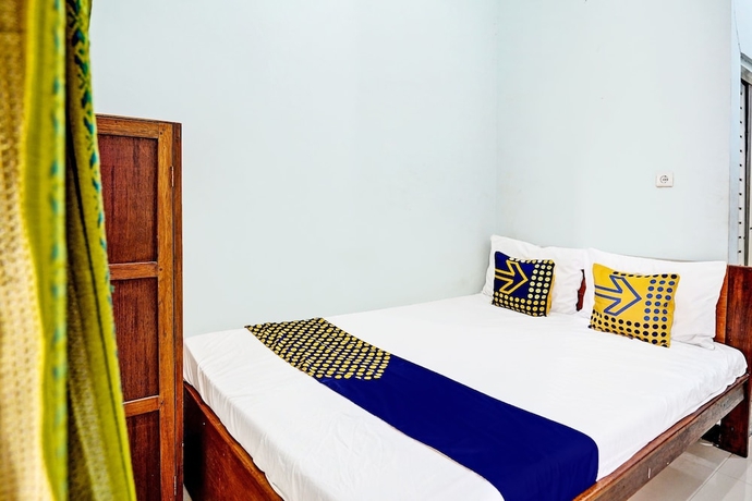 Imagen de la habitación del Hotel Capital O 93601 Manda Homestay. Foto 8