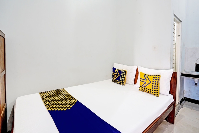 Imagen de la habitación del Hotel Capital O 93601 Manda Homestay. Foto 9