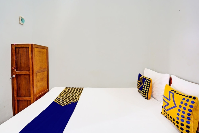 Imagen de la habitación del Hotel Capital O 93601 Manda Homestay. Foto 10