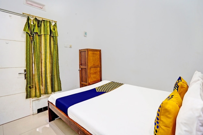 Imagen de la habitación del Hotel Capital O 93601 Manda Homestay. Foto 11