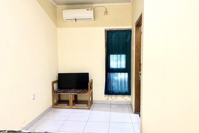 Imagen de la habitación del Hotel Capital O 93601 Manda Homestay. Foto 12