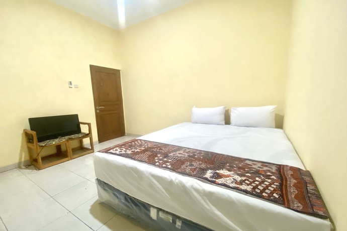 Imagen de la habitación del Hotel Capital O 93601 Manda Homestay. Foto 14