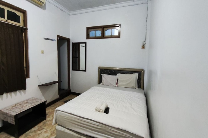 Imagen de la habitación del Hotel Capital O 93653 Kinasih. Foto 2