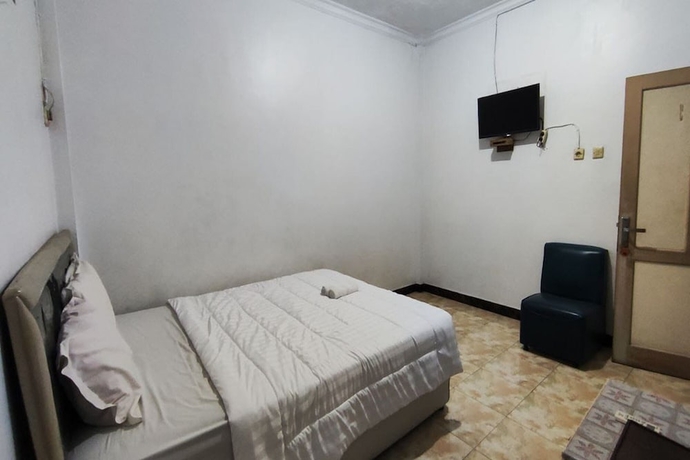Imagen de la habitación del Hotel Capital O 93653 Kinasih. Foto 3