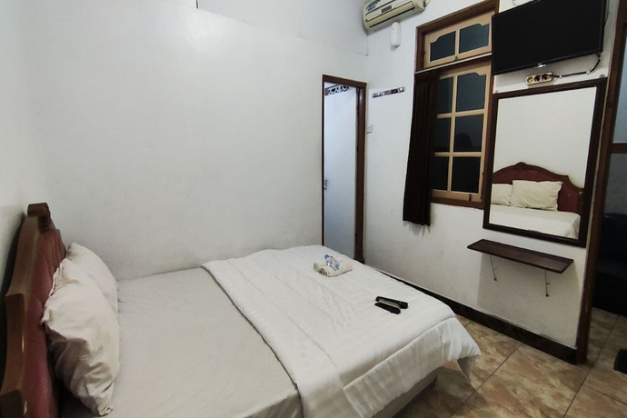 Imagen de la habitación del Hotel Capital O 93653 Kinasih. Foto 5