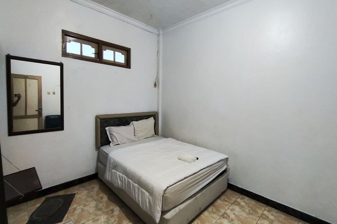 Imagen de la habitación del Hotel Capital O 93653 Kinasih. Foto 6