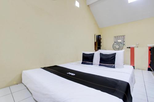 Imagen de la habitación del Hotel Capital O 93716 Family Guesthouse Syariah. Foto 20