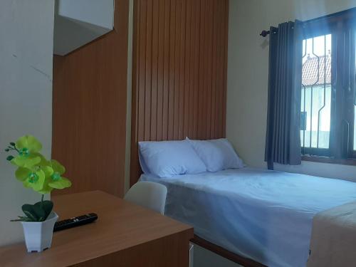 Imagen de la habitación del Hotel Capital O 93719 Homestay Omah Bidadari. Foto 19