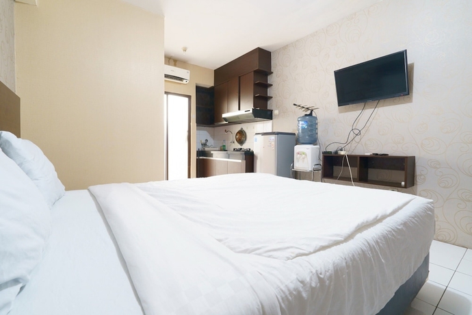 Imagen de la habitación del Hotel Capital O 93760 Apartemen Gateway Cicadas By Jh Group. Foto 3