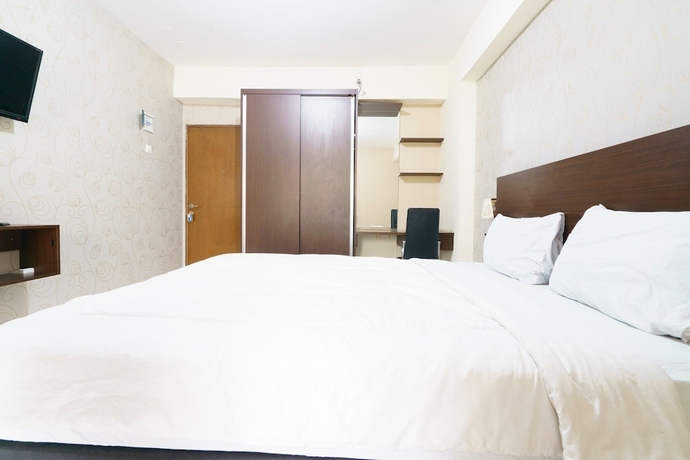 Imagen de la habitación del Hotel Capital O 93760 Apartemen Gateway Cicadas By Jh Group. Foto 5