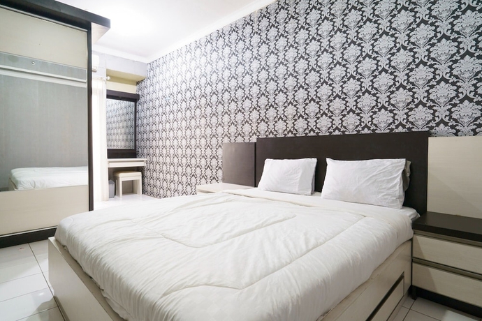 Imagen de la habitación del Hotel Capital O 93760 Apartemen Gateway Cicadas By Jh Group. Foto 6