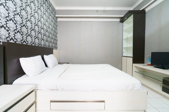 Imagen de la habitación del Hotel Capital O 93760 Apartemen Gateway Cicadas By Jh Group. Foto 7