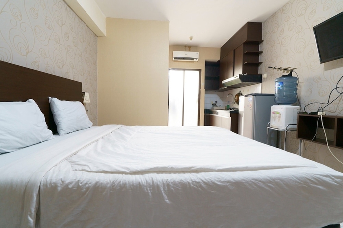 Imagen de la habitación del Hotel Capital O 93760 Apartemen Gateway Cicadas By Jh Group. Foto 8