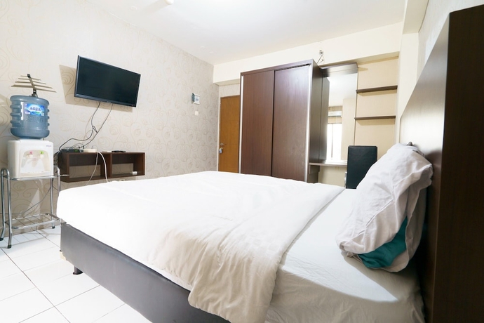 Imagen de la habitación del Hotel Capital O 93760 Apartemen Gateway Cicadas By Jh Group. Foto 10