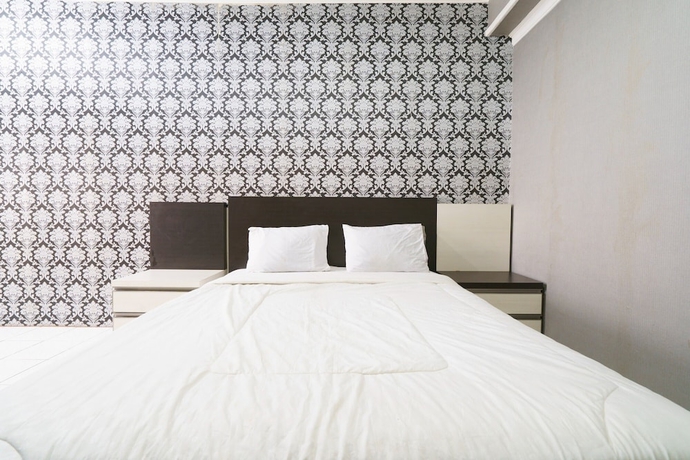 Imagen de la habitación del Hotel Capital O 93760 Apartemen Gateway Cicadas By Jh Group. Foto 11