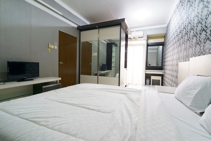 Imagen de la habitación del Hotel Capital O 93760 Apartemen Gateway Cicadas By Jh Group. Foto 14