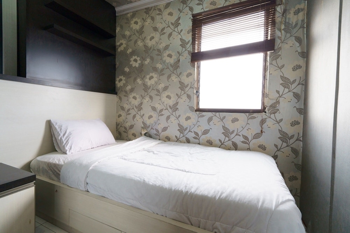 Imagen de la habitación del Hotel Capital O 93760 Apartemen Gateway Cicadas By Jh Group. Foto 16