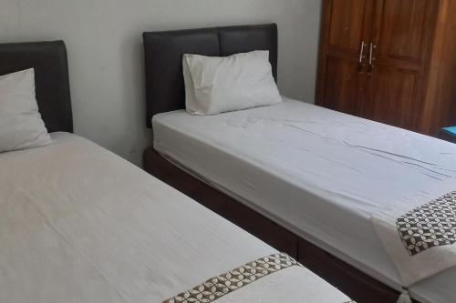 Imagen de la habitación del Hotel Capital O 93872 Natura Guest House Syariah. Foto 20