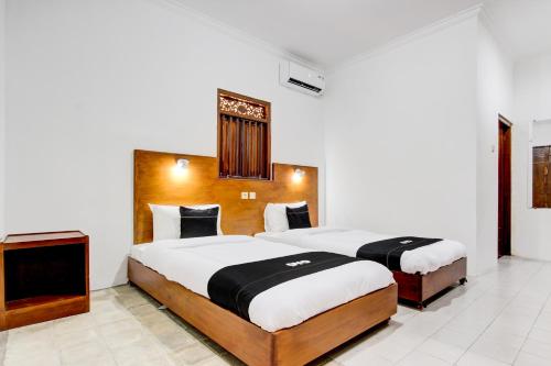 Imagen de la habitación del Hotel Capital O 93873 Sokkyo Homestay. Foto 20