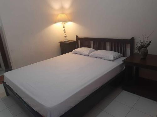Imagen de la habitación del Hotel Capital O 93938 Wisma Pamungkas Syariah. Foto 20