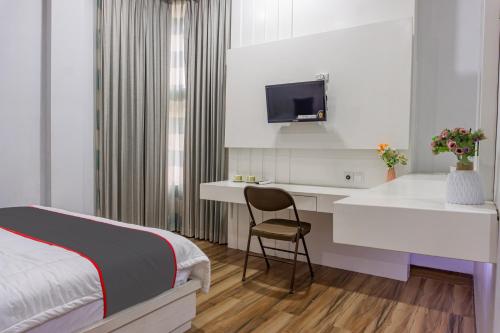 Imagen de la habitación del Hotel Capital O 93991 Hakobox Kostel. Foto 19