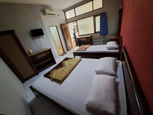 Imagen general del Hotel Capital O 94108 Abadi. Foto 16