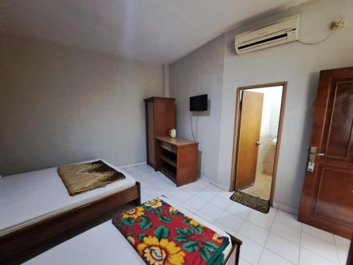 Imagen general del Hotel Capital O 94108 Abadi. Foto 18