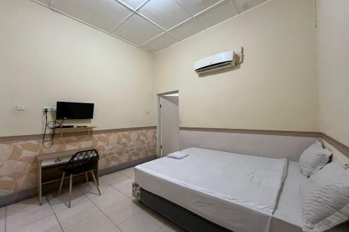 Imagen de la habitación del Hotel Capital O 94240 Asoka Syariah. Foto 16