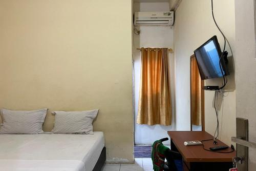 Imagen de la habitación del Hotel Capital O 94240 Asoka Syariah. Foto 17