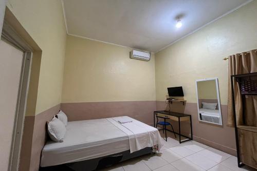 Imagen de la habitación del Hotel Capital O 94240 Asoka Syariah. Foto 18
