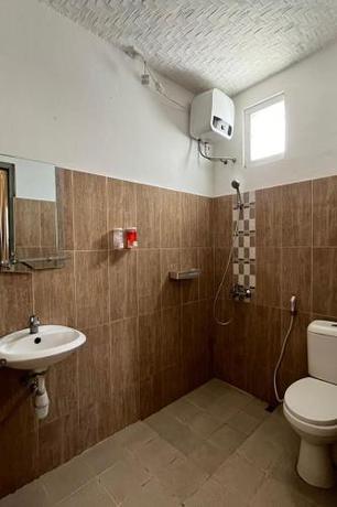 Imagen de la habitación del Hotel Capital O 94240 Asoka Syariah. Foto 19