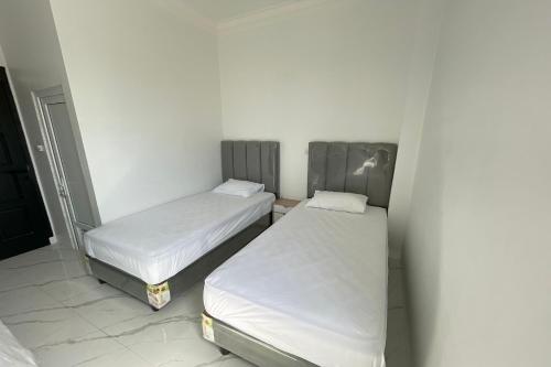 Imagen de la habitación del Hotel Capital O 94254 Dental Inn. Foto 18