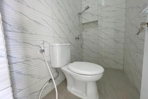 Imagen de la habitación del Hotel Capital O 94254 Dental Inn. Foto 19