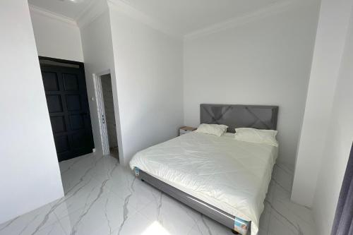 Imagen de la habitación del Hotel Capital O 94254 Dental Inn. Foto 20