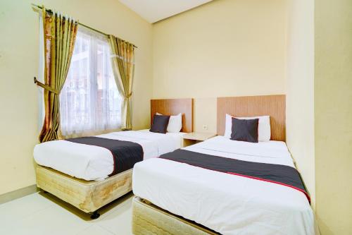 Imagen de la habitación del Hotel Capital O 94350 Rumah Suka Homestay. Foto 19