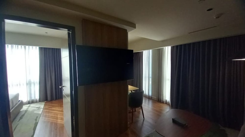 Imagen de la habitación del Hotel Capital O 950 Acqua Novotel Tower. Foto 12