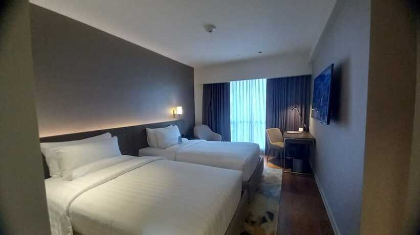 Imagen de la habitación del Hotel Capital O 950 Acqua Novotel Tower. Foto 15