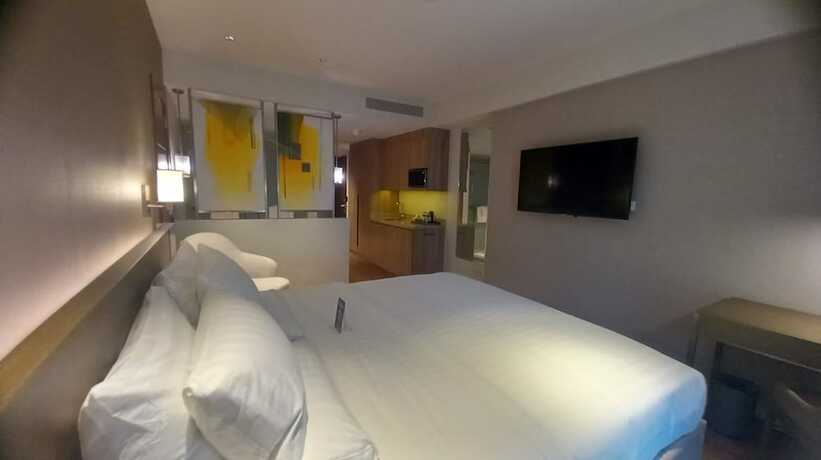 Imagen de la habitación del Hotel Capital O 950 Acqua Novotel Tower. Foto 18