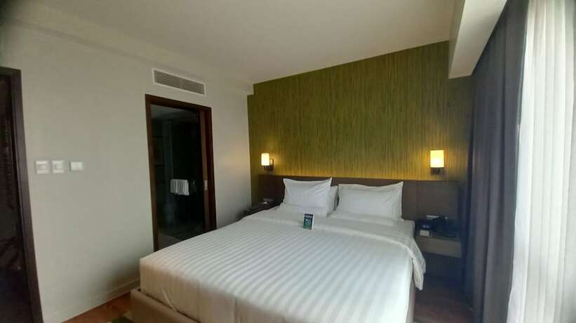 Imagen de la habitación del Hotel Capital O 950 Acqua Novotel Tower. Foto 20