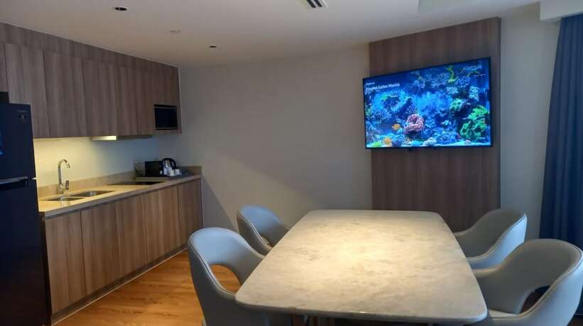 Imagen de la habitación del Hotel Capital O 950 Acqua Novotel Tower. Foto 22