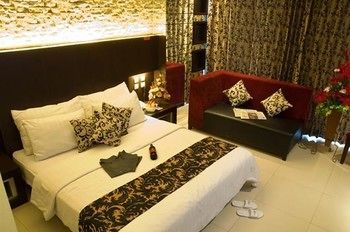 Imagen de la habitación del Hotel Capital O 991 D'batoe Boutique. Foto 5